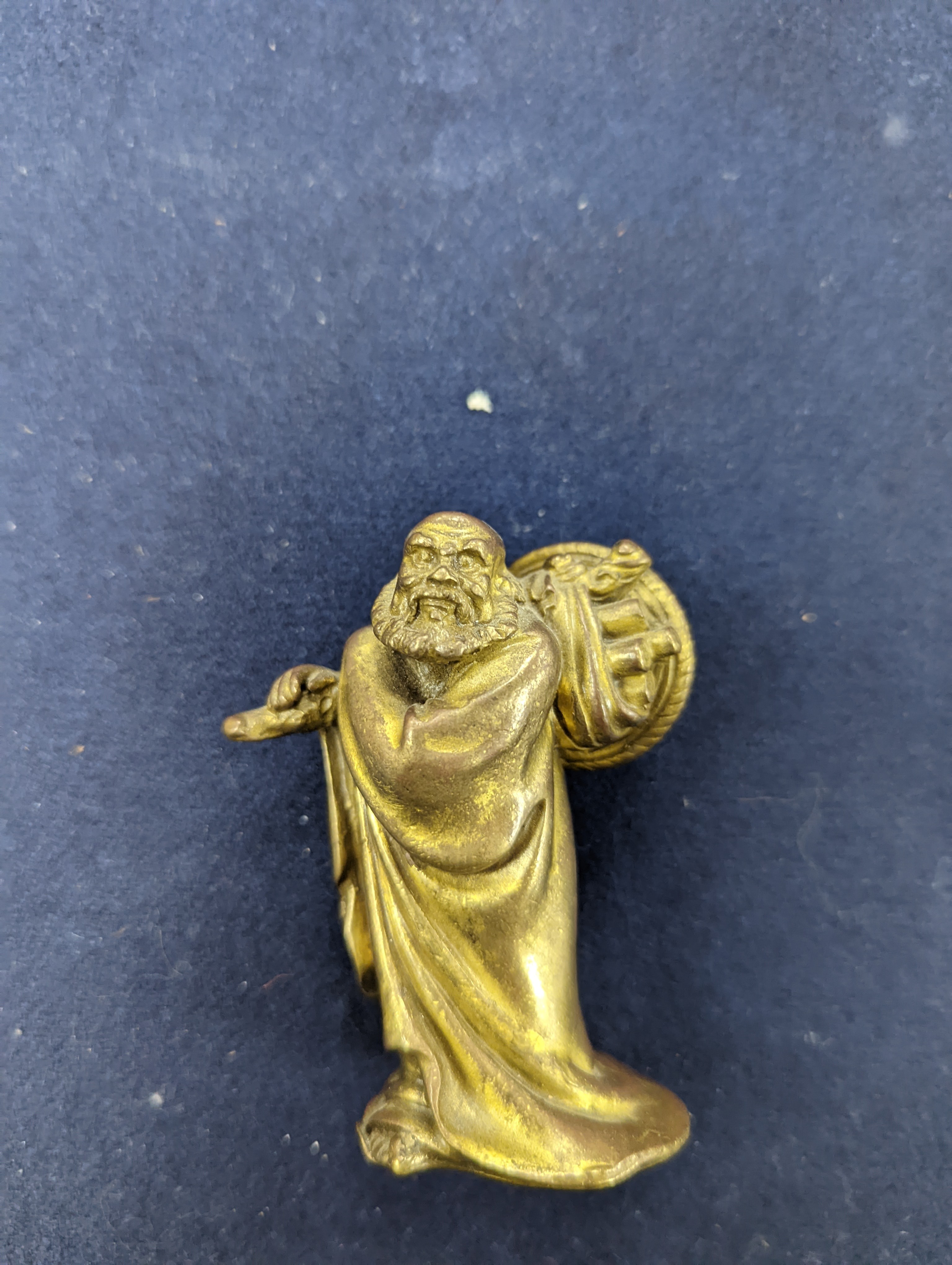 A Chinese gilt copper figure, a Chinese Dog of Fo, a bell, a censer, six Indian bronze figures and a scroll box
